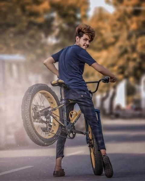 Premium Photo | Young indian boy in ethnic wear and showing smartphone with  new bike